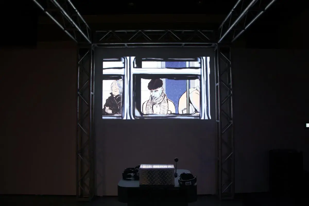 Subway Stories exhibited at SIGGRAPH with truss-mounted projection screen and physical crank interface on a pedestal