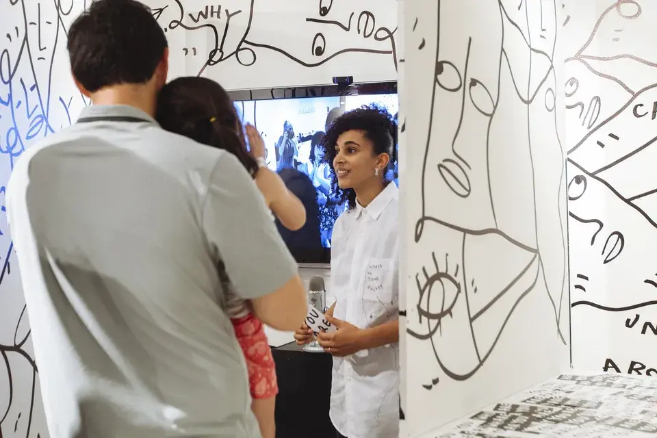 Shantell Martin drawing during the installation